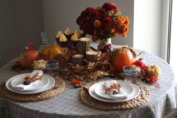 Festive autumn table setting with pumpkin