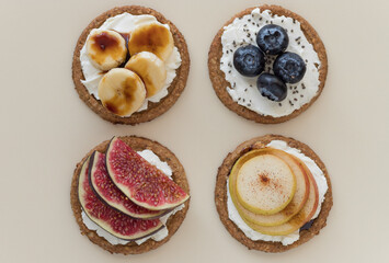 Set of crispbread toasts with different toppings on color background. Healthy food snack. flat lay