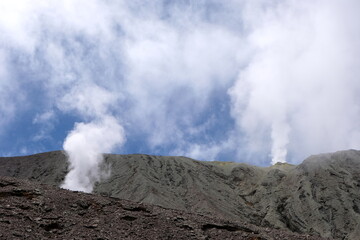 A volcano releasing swirling white sulphuric gas, steam and smoke through volcanic vents on Mt Balbi in Bougainville, Papua New Guinea