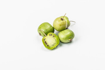 Ripe Actinidia arguta or kiwi isolated on white background