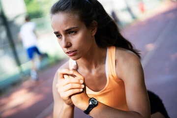 Beautiful athlete woman in sportswear. Young woman training outdoors. Healthy lifestyle.