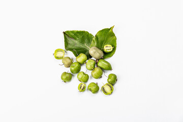 Ripe Actinidia arguta or kiwi isolated on white background