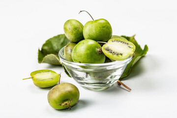 Ripe Actinidia arguta or kiwi isolated on white background