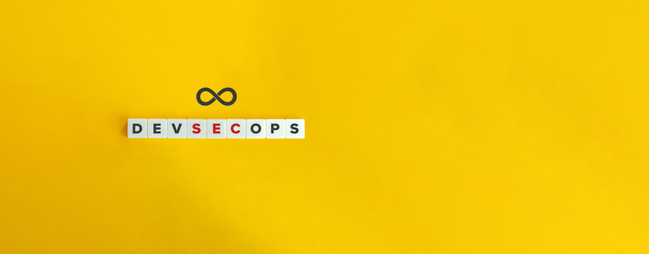 DevSecOps banner and concept. Block letters on bright orange background. Minimal aesthetics.