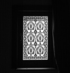 window in the dark with decorations on it