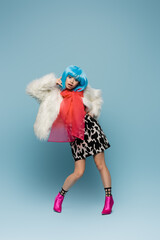 Asian model in pop art style posing on blue background