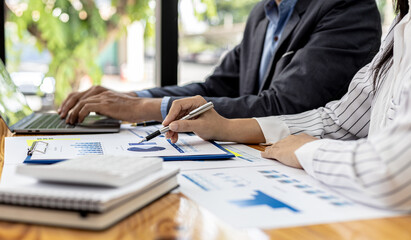 Executives and managers are meeting in a conference room, on the table there are some documents about the company's finances, managers are discussing financial information with the management.