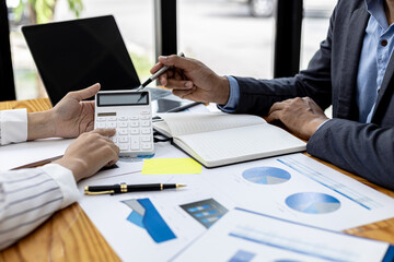 The sales department is having a monthly summary meeting to bring it to the department manager, they are verifying the correctness of the documents that are prepared before bringing in to the manager