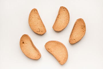 Breadcrumbs on a white plate. Rusks on a white background. Vanilla rusks.