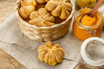 Pumpkin buns or biscuits, traditional fall baked goods. Seasonal ingredients for cooking food