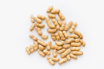 Peanuts in shells on a white background. Nuts on a white background.