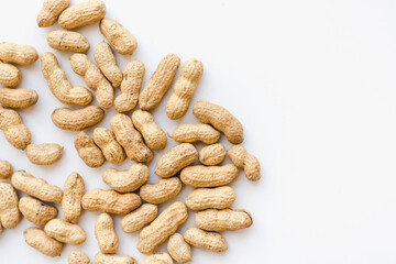 Peanuts in shells on a white background. Nuts on a white background.