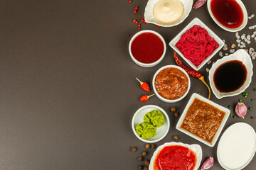 Set of different sauces - ketchup, mayonnaise, barbecue, soy, chutney, wasabi, adjika, horseradish