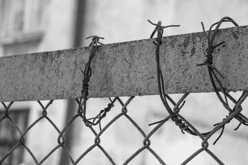 Close up of features of a barbed wire fence