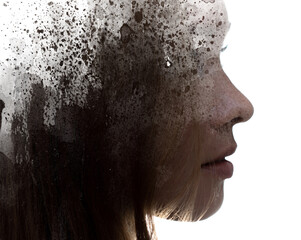 A profile portrait of a woman combined with black ink splashes. Paintography.