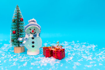 snowman, presents and Christmas tree snow with copy space.new year celebration.
