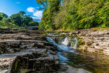 A close up view of the upper falls at Stainforth Force, Yorkshire in summertime