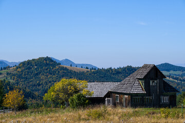 Fototapeta na wymiar Old wooden country house on Tihuta pass, Transylvania, Romania