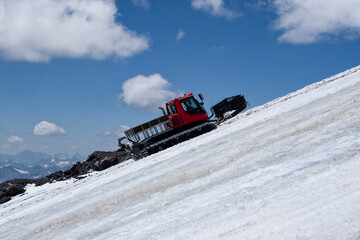 Snow grooming machine climbing on Elbrus glacier
