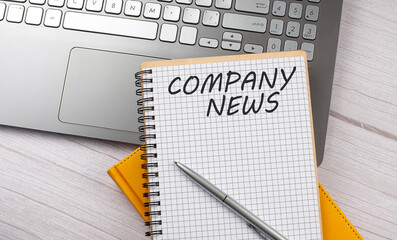 COMPANY NEWS text written on a notebook on the laptop