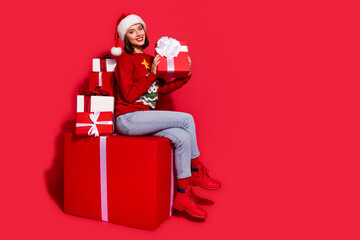 Full body profile side photo of youth lady gift ads shopping advent magic isolated over red color background
