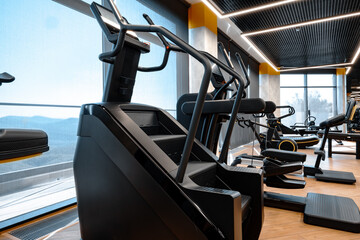 Fototapeta na wymiar Modern gym interior with new fitness equipment
