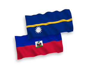 National vector fabric wave flags of Republic of Haiti and Republic of Nauru isolated on white background. 1 to 2 proportion.