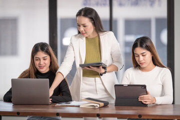 College instructors and advisors meet female college students to advise their research study. Education Concept Stock Photo