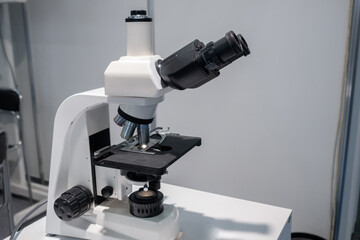 Close up view of laboratory equipment, optical microscope. Science, biology, optical and education concept