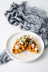 Croffle (a compound word of croissant and waffle) is a dessert where croissant raw paper is baked in a waffle pan and eaten with ice cream or maple syrup.