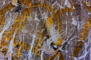 Scratched wall with inscriptions and collapsed plaster. Vandalism.