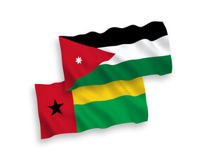 National vector fabric wave flags of Republic of Guinea Bissau and Hashemite Kingdom of Jordan isolated on white background. 1 to 2 proportion.
