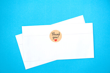 Two white envelopes on a blue background