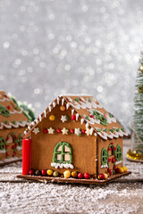 Christmas gingerbread house on wooden table. Copy space