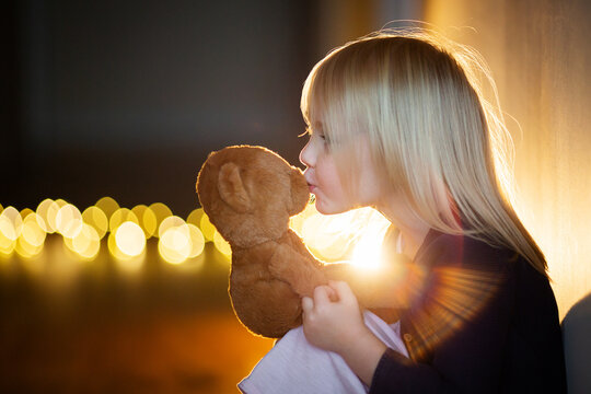 a girl with a taddy bear