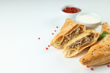 Concept of tasty food with samsa on white background