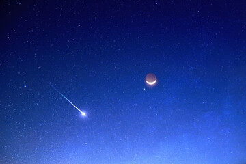 Astronomical conjunction of Venus and Moon and a shooting star.