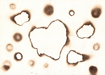 Vintage burned paper edges heart background