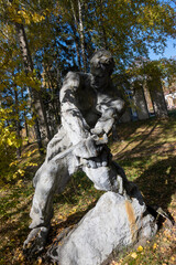 Fototapeta na wymiar Soviet era statue in the park