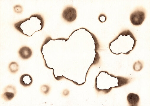 Vintage burned paper edges heart background