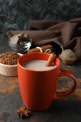 Concept of tasty drink with cocoa on dark table