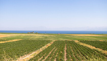 views of the sea, steppe plains and mountain silhouettes in the distance.