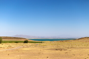 views of the sea, steppe plains and mountain silhouettes in the distance.