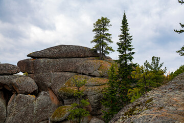 The top of the stone tale against the background of the cloudy sky.
