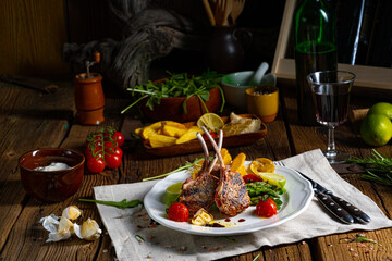 Lamb chops marinated in herbs with green asparagus and lime