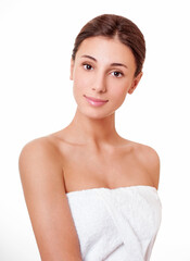 Beautiful face of young adult woman with clean fresh skin.