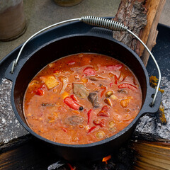 Kettle goulash is prepared over an open fire!