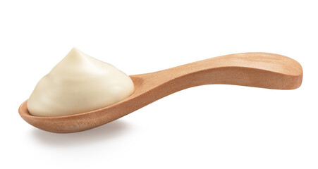 mayonnaise in a special wooden spoon for sauces isolated on white