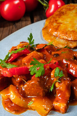 Original Hungarian goulash with potato pancakes