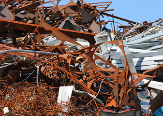 pile of rusty ferrous scrap in a landfill of a foundry